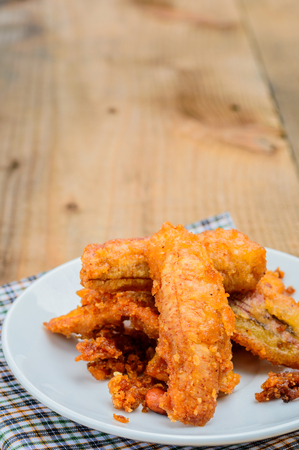 deep-fried sliced banana on a wood floorの写真素材