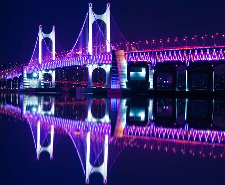 GwangAn Bridge and Haeundae at night in Busan,Koreaの写真素材