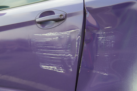 Scratched car paint with doorの写真素材
