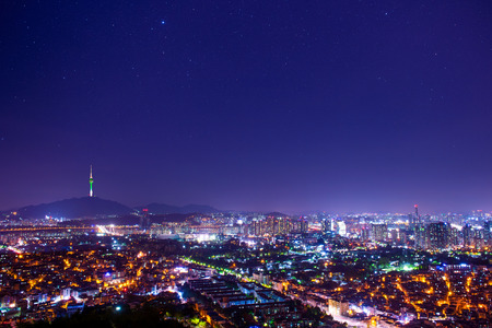 Downtown skyline of Seoul, South Korea with Seoul Tower and starの写真素材