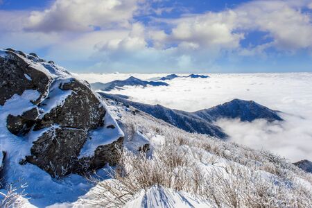 Seoraksan mountains is covered by morning fog in winter, Korea.の写真素材