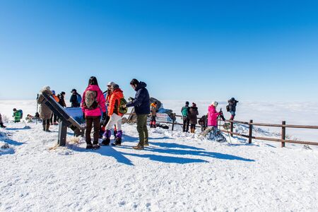 DEOGYUSAN,KOREA - JANUARY 23: Tourists taking photos of the beautiful scenery and skiing around Deogyusan,South Korea on January 23, 2015.のeditorial素材