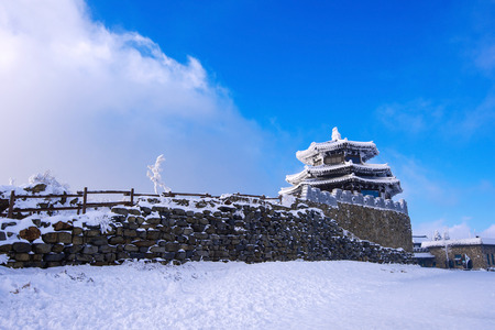 Wooden house is covered by snow in winter, Deogyusan mountains South Korea.の写真素材