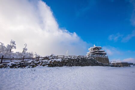 Deogyusan mountains is covered by snow and morning fog in winter,South Korea.の写真素材