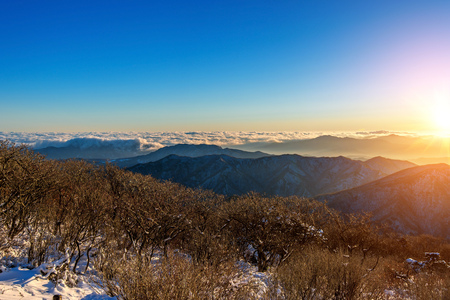 Sunrise with beautiful Lens Flare at Deogyusan mountains in winter,South Korea.の写真素材