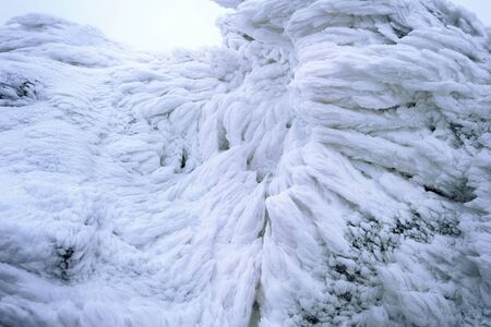 Wind painted Snow Texture Pattern on stone Background, Winter background.の写真素材