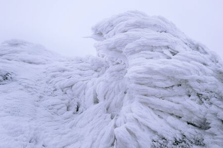 Wind painted Snow Texture Pattern on stone Background, Winter background.の写真素材