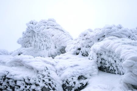 Wind painted Snow Texture Pattern on stone Background, Winter background.の写真素材