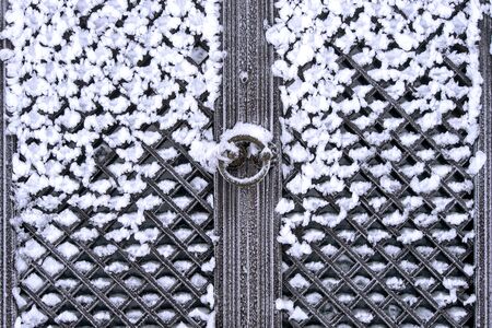 Snow covered Antique door.の写真素材