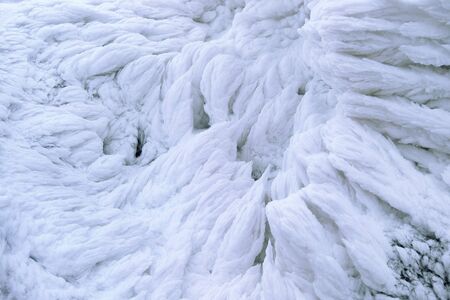Wind painted Snow Texture Pattern on stone Background, Winter background.の写真素材