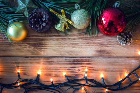 Christmas background with christmas gift,red balls, pine cones on Wooden Background. Christmas vintage styleの写真素材