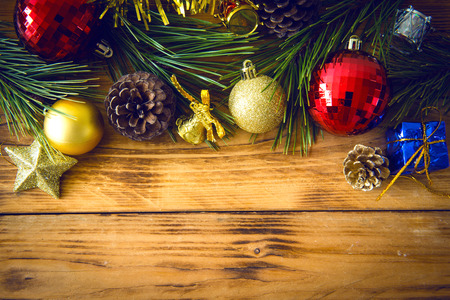 Christmas background with christmas gift,red balls, pine cones on Wooden Background. Christmas vintage styleの写真素材