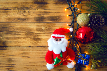 Christmas background with christmas gift,red balls, pine cones on Wooden Background. Christmas vintage styleの写真素材