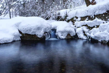 Winter landscape, Waterfall and river on the forest in winter.の写真素材