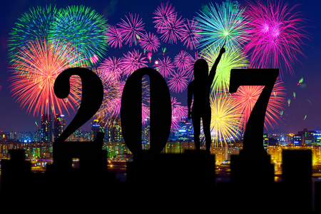 Silhouette of Happy new year 2017 and firework.