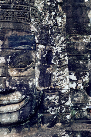 Ancient stone faces of Bayon temple, Angkor Wat, Siam Reap, Cambodia.の写真素材