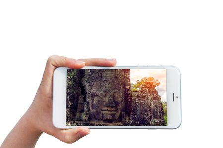 Hand holding Smartphone with image of Angkor Wat Temple, Siem reap in Cambodia.の写真素材