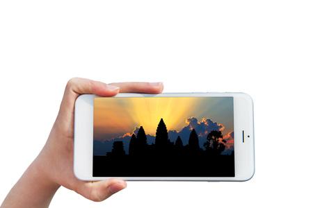 Hand holding Smartphone with image of Angkor Wat Temple, Siem reap in Cambodia.の写真素材