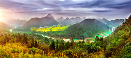 Panorama of Jiulong waterfall at sunset in Luoping, China.の写真素材
