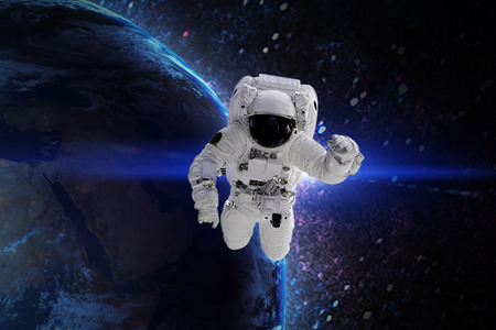 Astronaut in galaxy. Elements of this image furnished by NASA.の写真素材