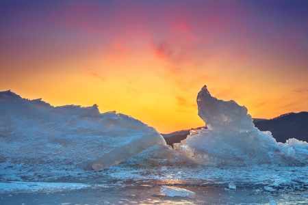 Very large and beautiful chunk of Ice at Sunrise in winter.