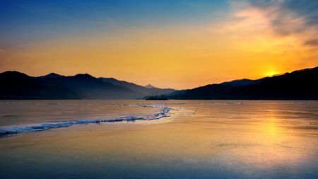 Very large and beautiful chunk of Ice at Sunrise in winter.の写真素材