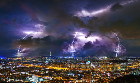 Thunderstorm clouds with lightning at night in Seoul, South Korea.のeditorial素材
