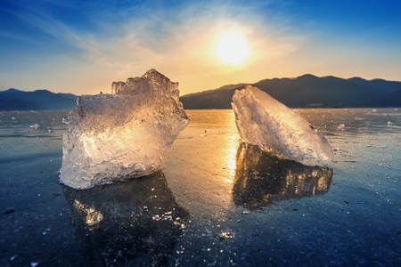 Very large and beautiful chunk of Ice at Sunrise in winter.の写真素材
