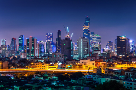 Bangkok cityscape and traffic at night in Thailand.
