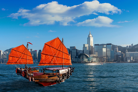 Victoria Harbour with junk ship in Hong Kong.の写真素材