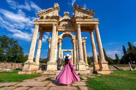 Beautiful girl walking at Aphrodisias ancient city in Turkey.の写真素材
