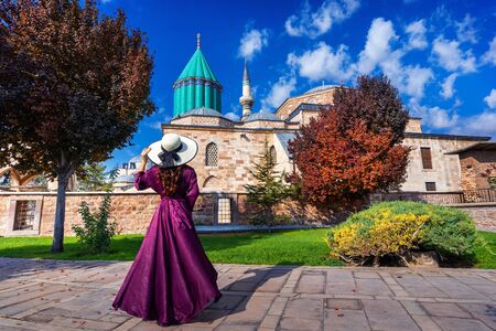 Beautiful girl walking at mosque in Konya, Turkey.の写真素材