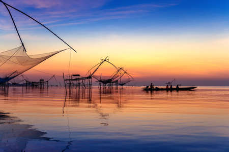 Beautiful sunrise and fishing dip nets at Pakpra in Phatthalung, Thailand.の写真素材