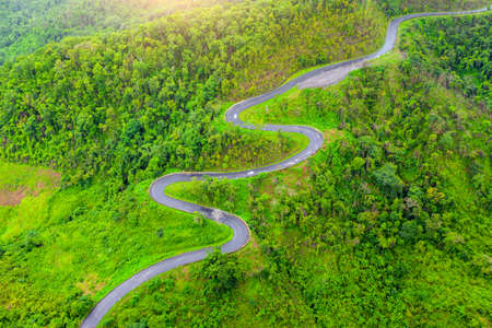Aerial view of Beautiful sky road over top of mountains with green jungle in Nan province, Thailand.の写真素材