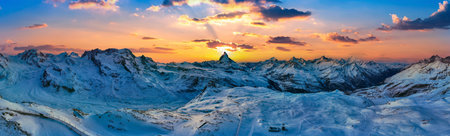 Matterhorn and swiss alps at sunset in Zermatt, Switzerland. Panorama landscape of alps in winter.の写真素材