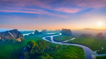 Panorama of Phang Nga bay with mountains at sunset in Thailand.の写真素材