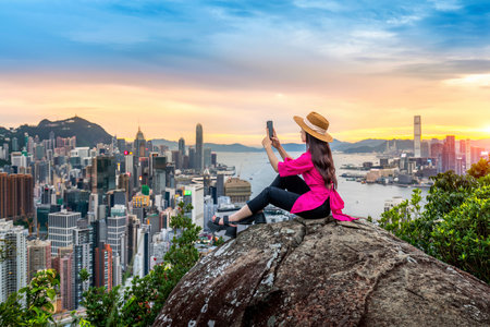 Tourist sitting on viewpoint in Hong Kong.の写真素材