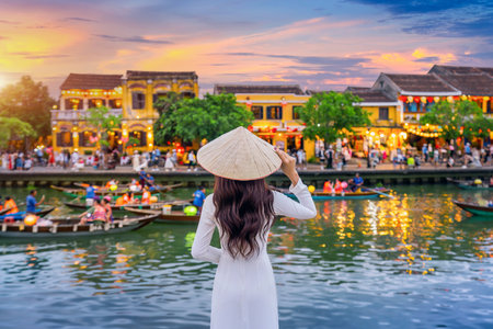 Asian woman wearing vietnam culture traditional at Hoi An ancient town,Hoi an city in Vietnam.の写真素材