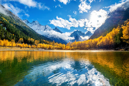 Bipenggou national park with snow mountains in autumn, Sichuan in China.
