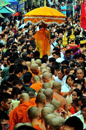 Stock Photo - Chiang Mai,Thailand - In the Buddhist Lent, rituals are great. The priest filed per row, together many early in the morning, then there will be people of the food put in a bowl.のeditorial素材