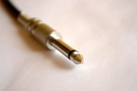 electric guitar cable with jack on a white backgroundの写真素材