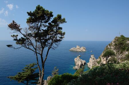 Beautiful view to the rocks in the Ionian Sea from slopes near the monastery of Palaiokastritsa in Corfu, Greece         の写真素材