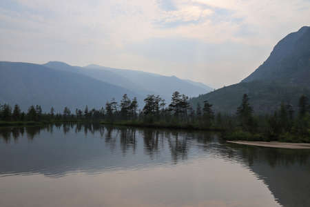 Foggy morning on Jack London Lake, the mouth of the Purga River, Magadan region, Russian Far Eastの写真素材
