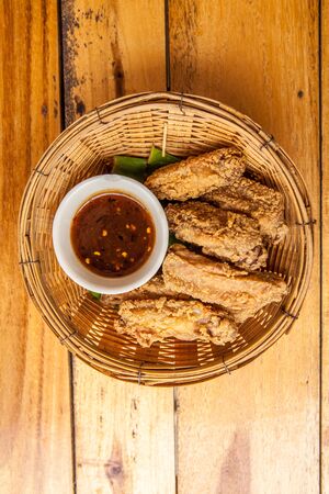 Crispy fried chicken strips with chili sauce の写真素材