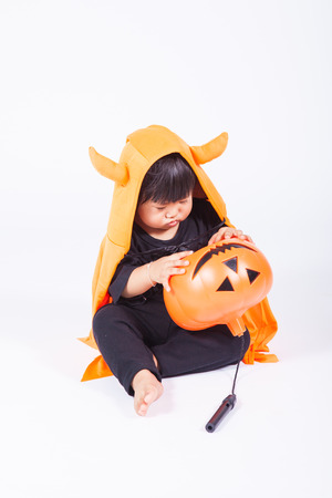 1 year olds kid play halloween pumkinの写真素材