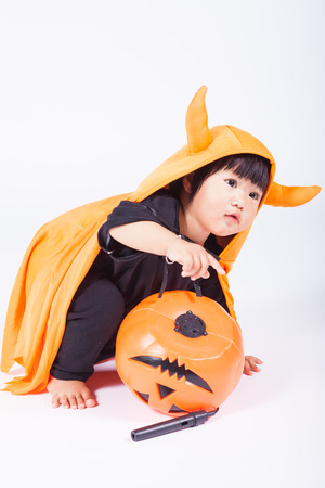 1 year olds kid play halloween pumkinの写真素材