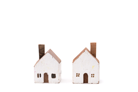 Miniature white wood house on white backgroundの写真素材