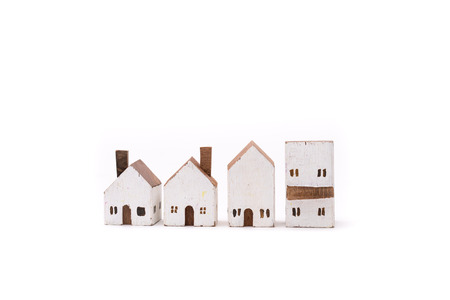 Miniature white wood house on white backgroundの写真素材