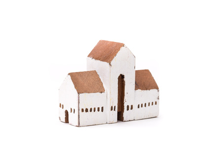 Miniature white wood house on white backgroundの写真素材