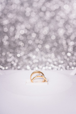 gold ring with diamond. Jewelry with bokeh backgroundの写真素材